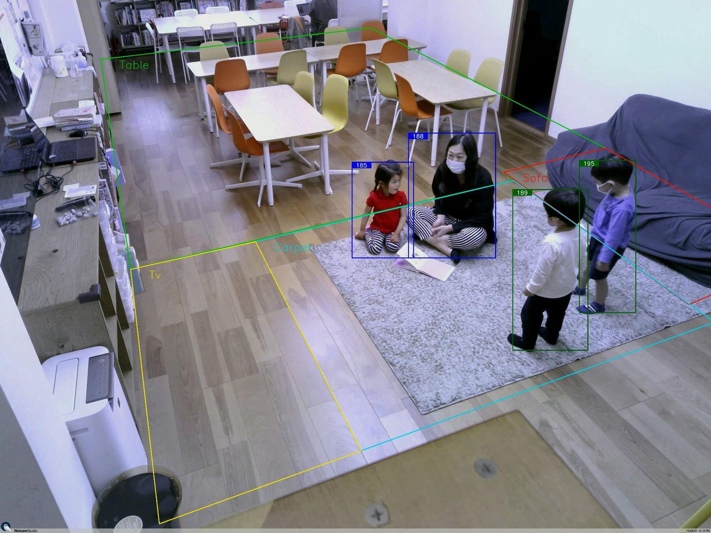 Camera view with person detection boxes used for social distancing monitoring